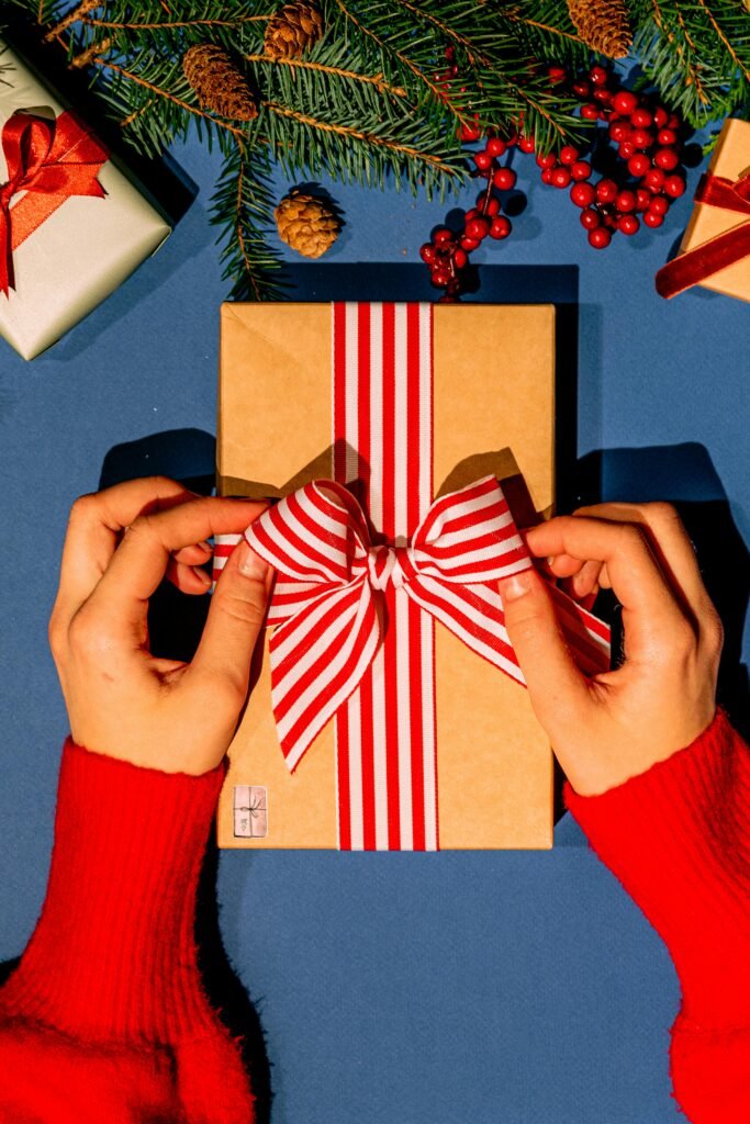 A Person Holding White and Red Gift Box